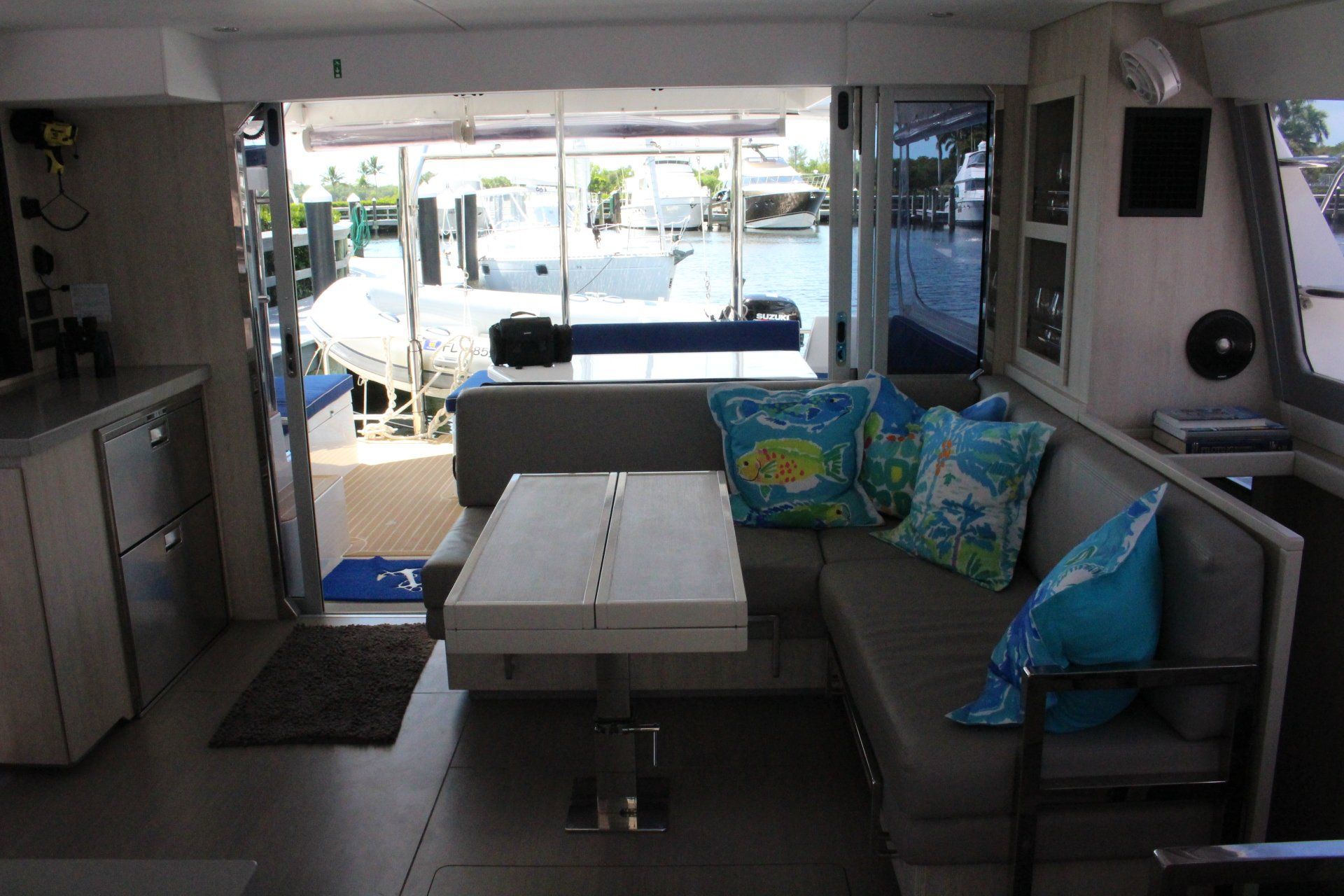 A living room on a boat with a couch and a table