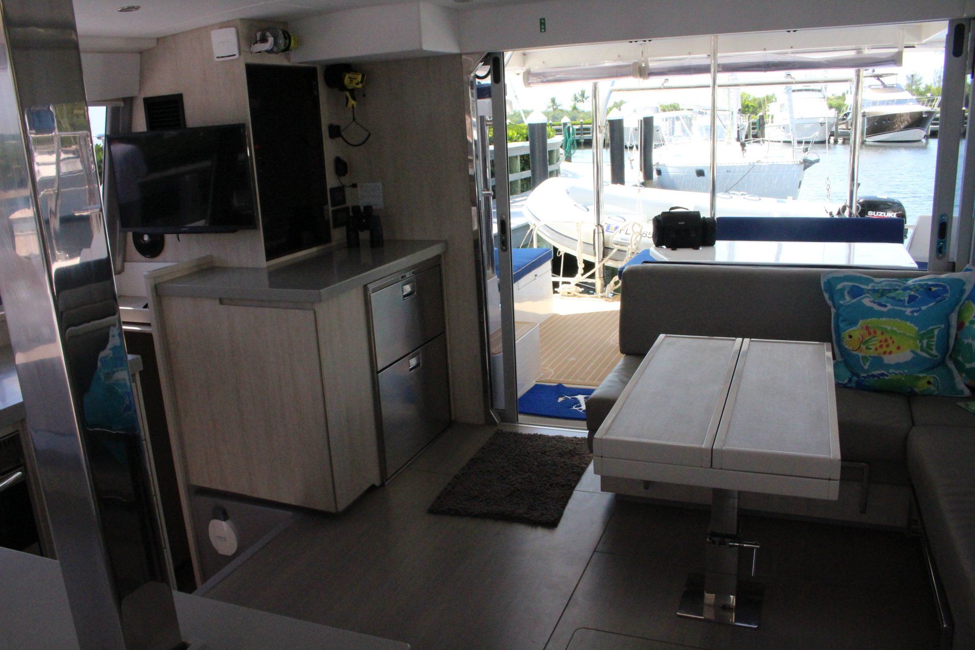 A living room on a boat with a table and couch
