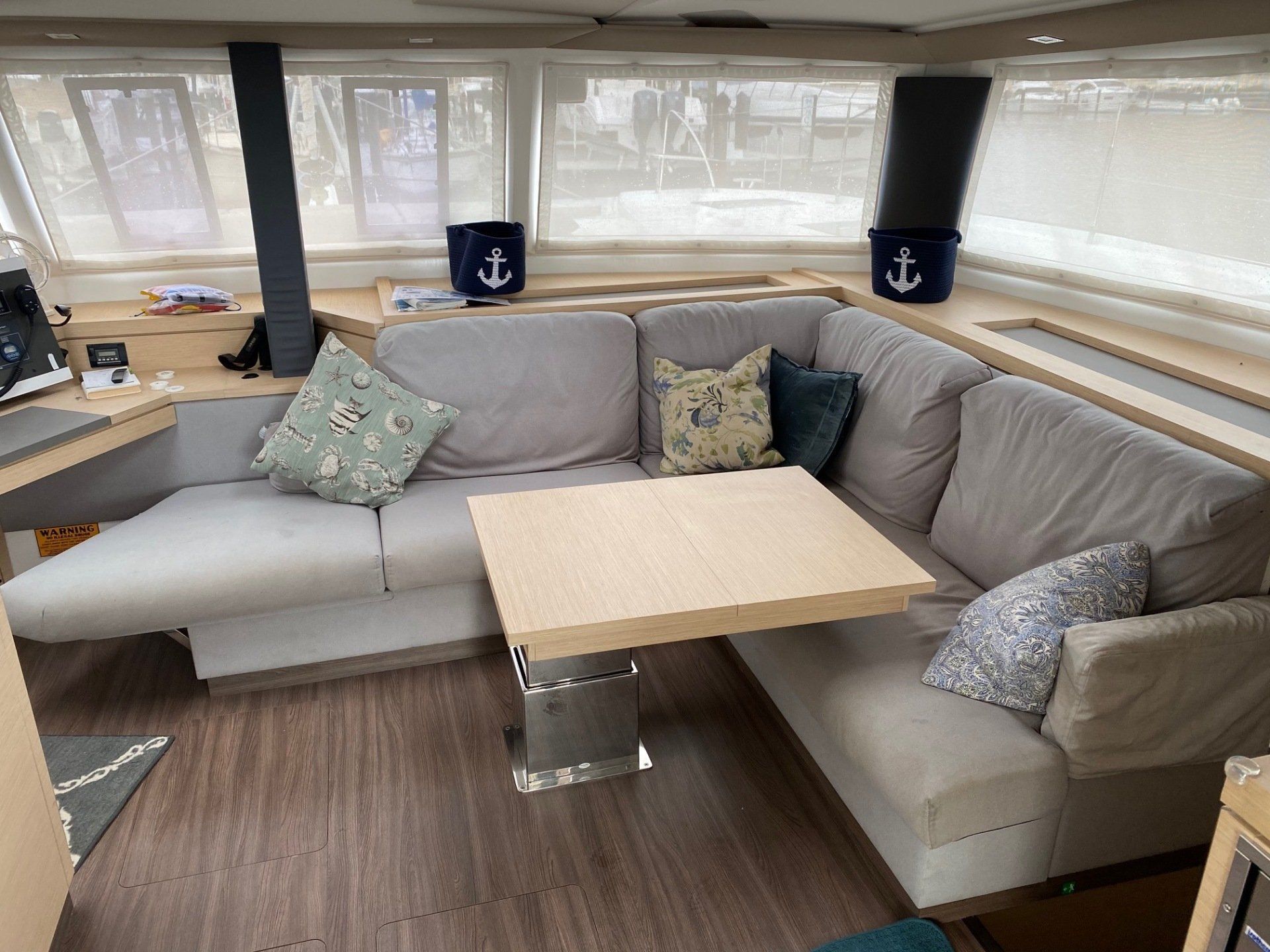 A living room with a couch and a table on a boat.
