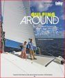 A couple is standing on the deck of a sailboat.