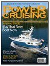 A blue and white boat is on the cover of a power cruising magazine.