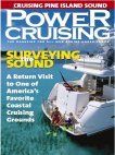 The cover of a power cruising magazine with a boat on it.