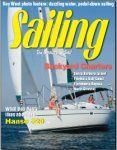 A sailboat is on the cover of a magazine called sailing.