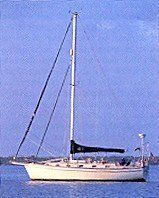 A sailboat is floating on top of a body of water.