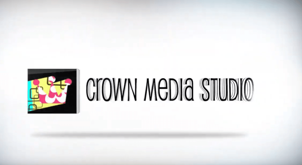 A logo for crown media studio with a crown on it
