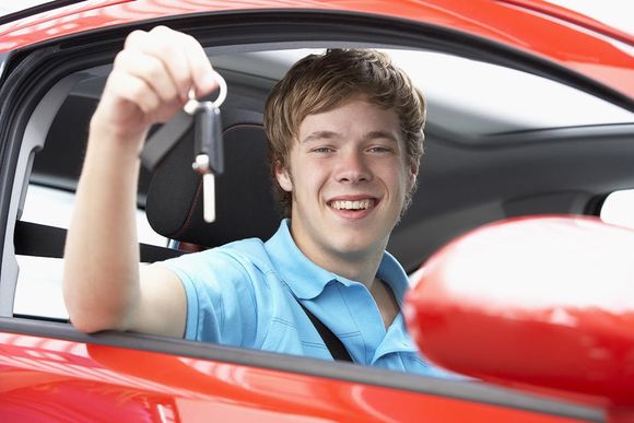 man holding car keys