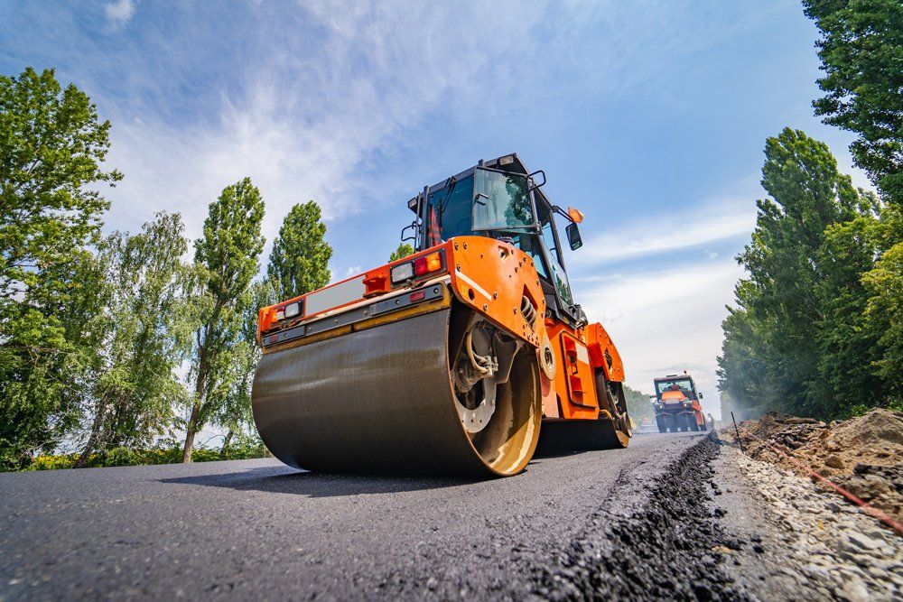 Road Repair and Compactor Lays Asphalt — Oxnard, CA — B C Rincon Construction, Inc.