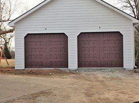 Garage with wooden door — Wood garage door in Harrisonville, MO Garage with wooden door — Wood garage door in Harrisonville, MO