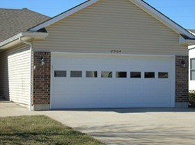 Garage with metal door — metal garage door in Harrisonville, MO Garage with metal door — metal garage door in Harrisonville, MO