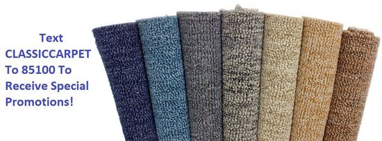 A bunch of carpets are stacked on top of each other on a white background.