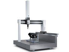 A machine is sitting on top of a table on a white background.