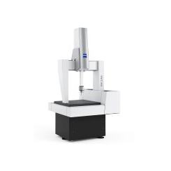 A machine is sitting on top of a table on a white background.