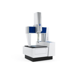 A white and blue machine is sitting on a white surface.