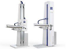 Two robots are sitting next to each other on a white background.
