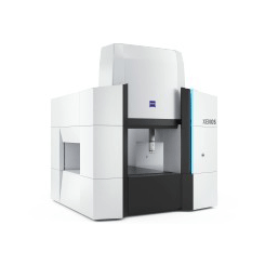 A white and black machine is sitting on a white surface.