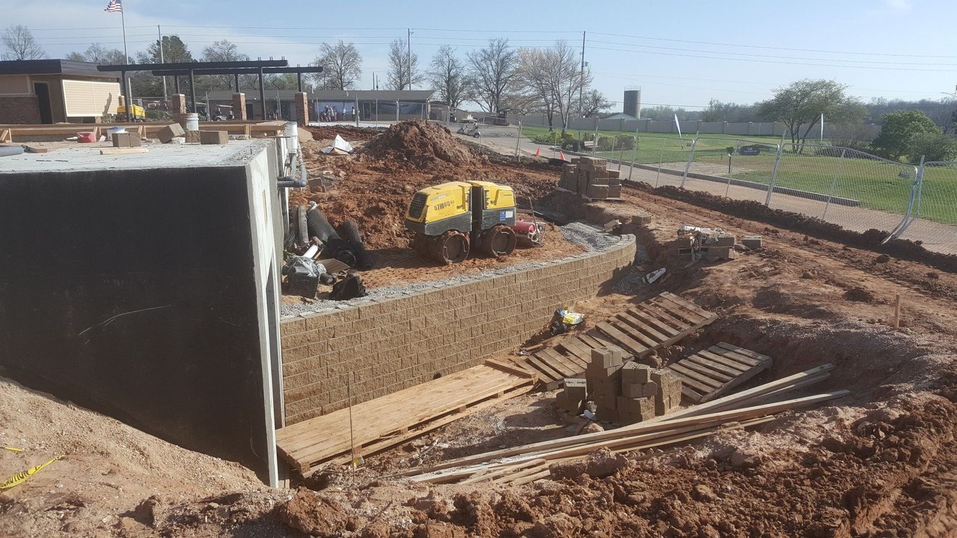 Wall Unit — Outside View Of A House Under Repair in Wichita, KS
