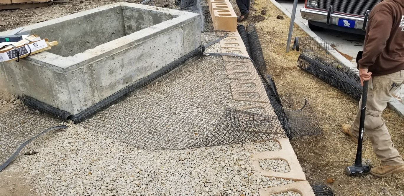 Rock Wall — Man Using Sledge Hammer in Wichita, KS