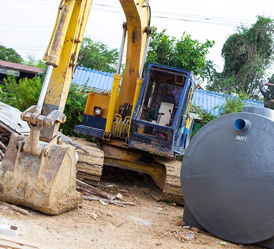 Septic Installations — Backhoe and Septic Tank in Charlotte, NC