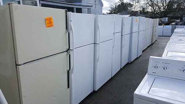 Row of Refrigerators Outside — Appliance in Sacramento, CA Row of Refrigerators Outside — Appliance in Sacramento, CA