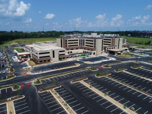Brick — Aerial View of Baptist Hospital and Empty Parking Area in Bartlett, TN
