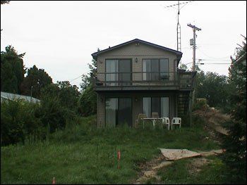 A house with a lot of grass in front of it