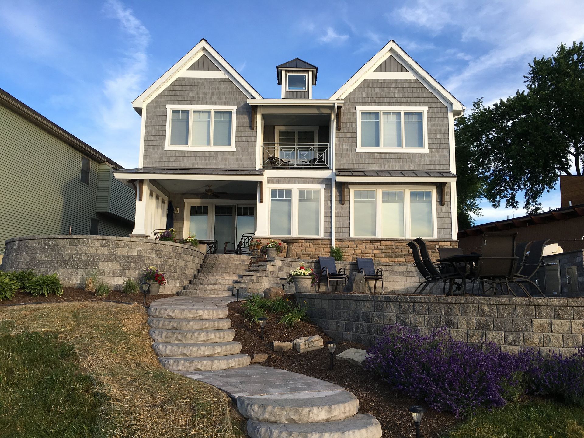A large house with stairs leading up to it