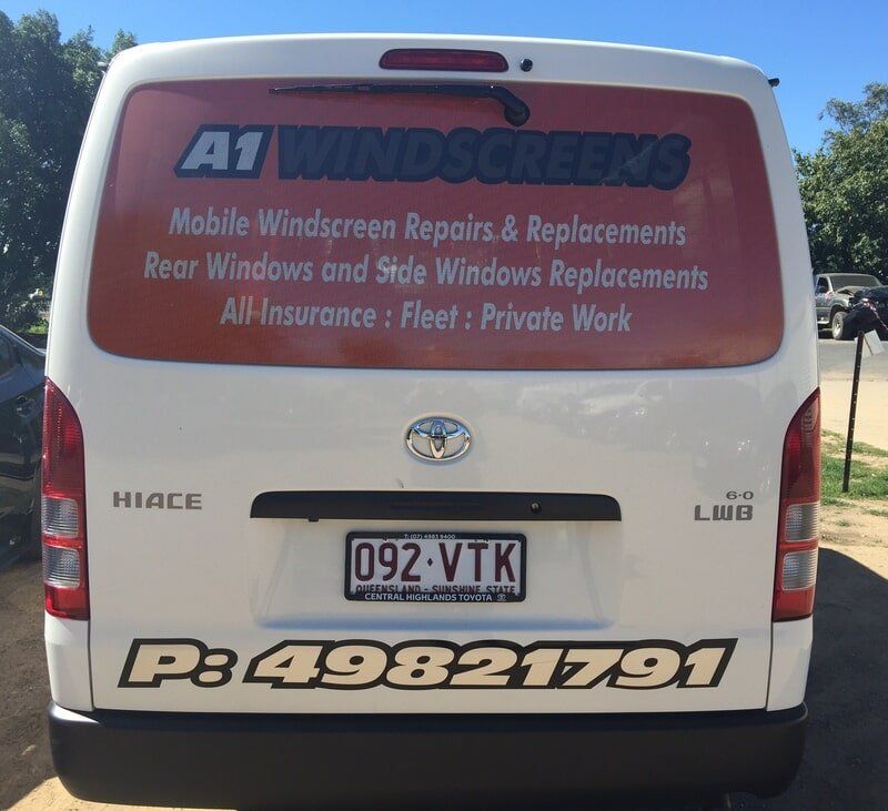 White Van Rear With A1 Windscreens Signage and Business Contact Details on the Back Window and Bumper — A1 Panel & Paint In Emerald, QLD