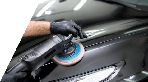 Person Polishing a Black Car With a Power Buffer and Blue Pad — A1 Panel & Paint In Emerald, QLD