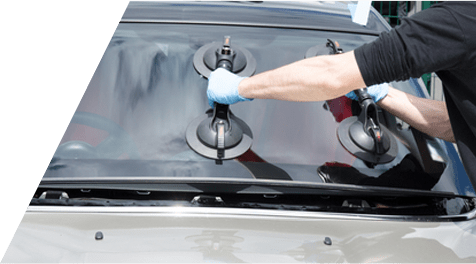 Person Using a Suction Cup Tool on a Black Car Roof to Repair or Remove Dents — A1 Panel & Paint In Emerald, QLD