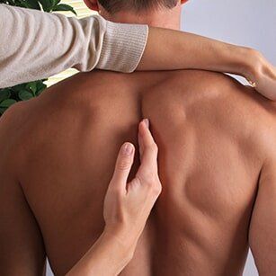 Chiropractic — Man Having Chiropractic Back Adjustment in Redding, CA Chiropractic — Man Having Chiropractic Back Adjustment in Redding, CA