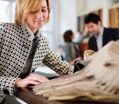 Woman choosing carpet design — Carpet in Bremerton WA