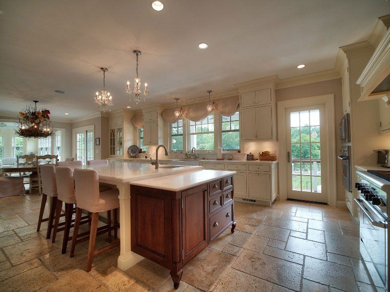A large kitchen with a large island in the middle
