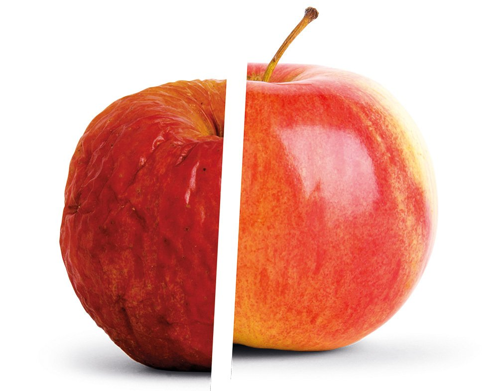 A side-by-side comparison of a red apple, contrasting a shriveled, dehydrated half on the left with a smooth, crisp, and fresh half on the right.