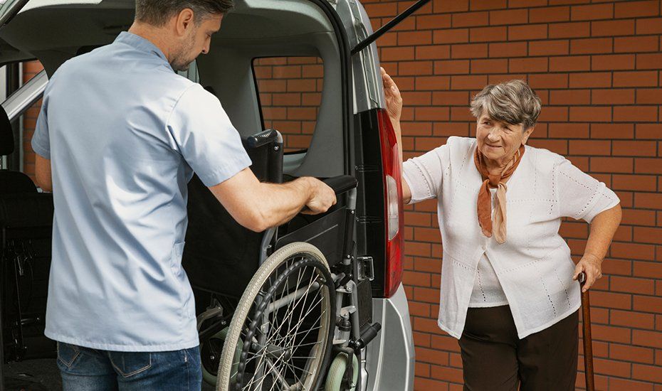 Caregiver Holding The Wheelchair For Elderly Woman — Lawrenceville, GA — Professional and Quality Home Care Caregiver Holding The Wheelchair For Elderly Woman — Lawrenceville, GA — Professional and Quality Home Care