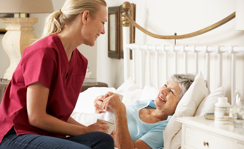 Woman Checking The Eldery Woman On Bed — Lawrenceville, GA — Professional and Quality Home Care Woman Checking The Eldery Woman On Bed — Lawrenceville, GA — Professional and Quality Home Care