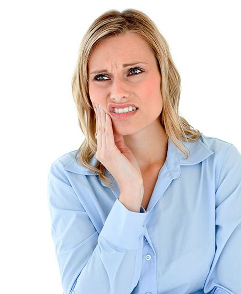 Lady suffering from TMJ symptoms Lady suffering from TMJ symptoms