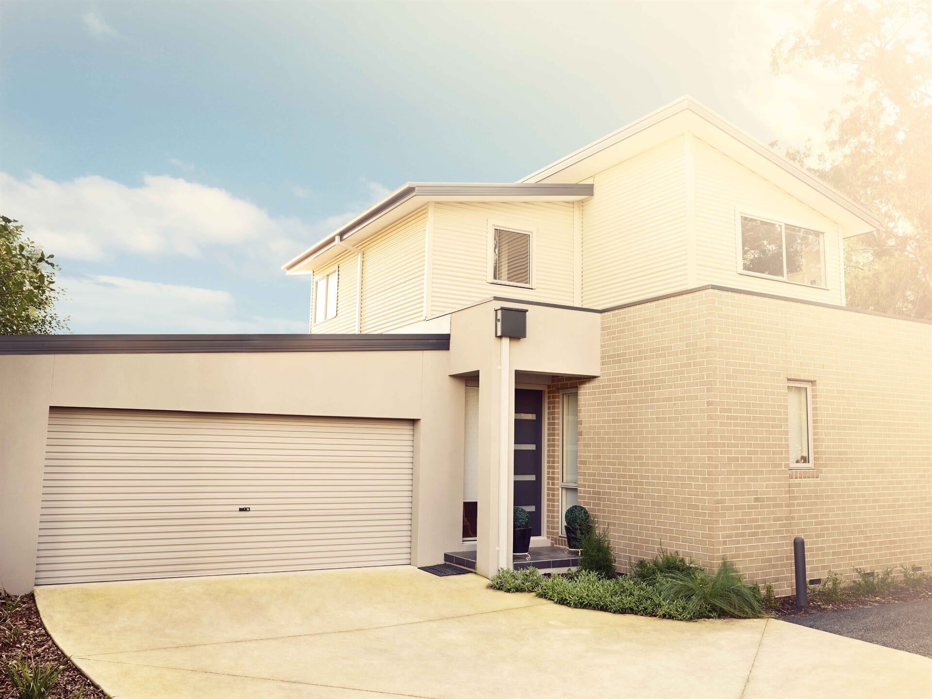 Black Garage Door — Garage Doors in Port Macquarie, NSW Black Garage Door — Garage Doors in Port Macquarie, NSW