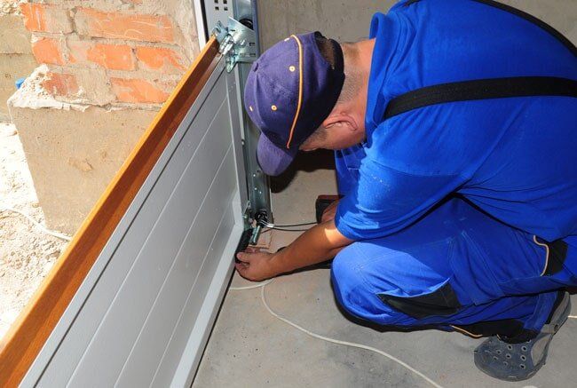 Repairing a Garage Door — Garage Doors in Port Macquarie, NSW Repairing a Garage Door — Garage Doors in Port Macquarie, NSW