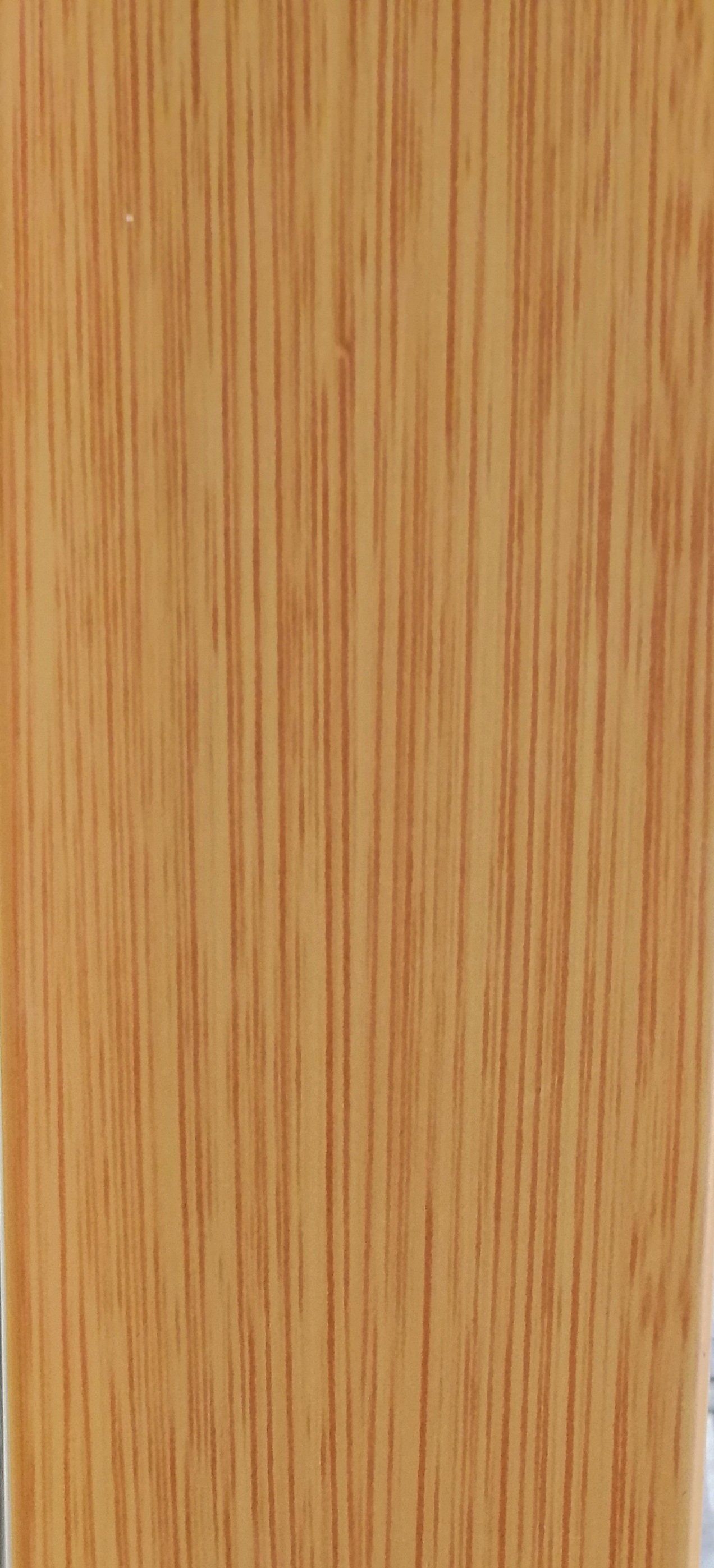A close up of a piece of wood showing the grain and texture.