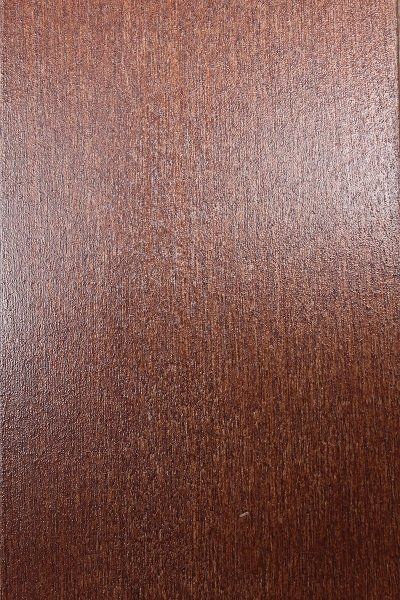 A close up of a piece of brown wood.