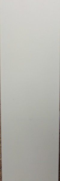 A white sheet of paper is sitting on a wooden table.