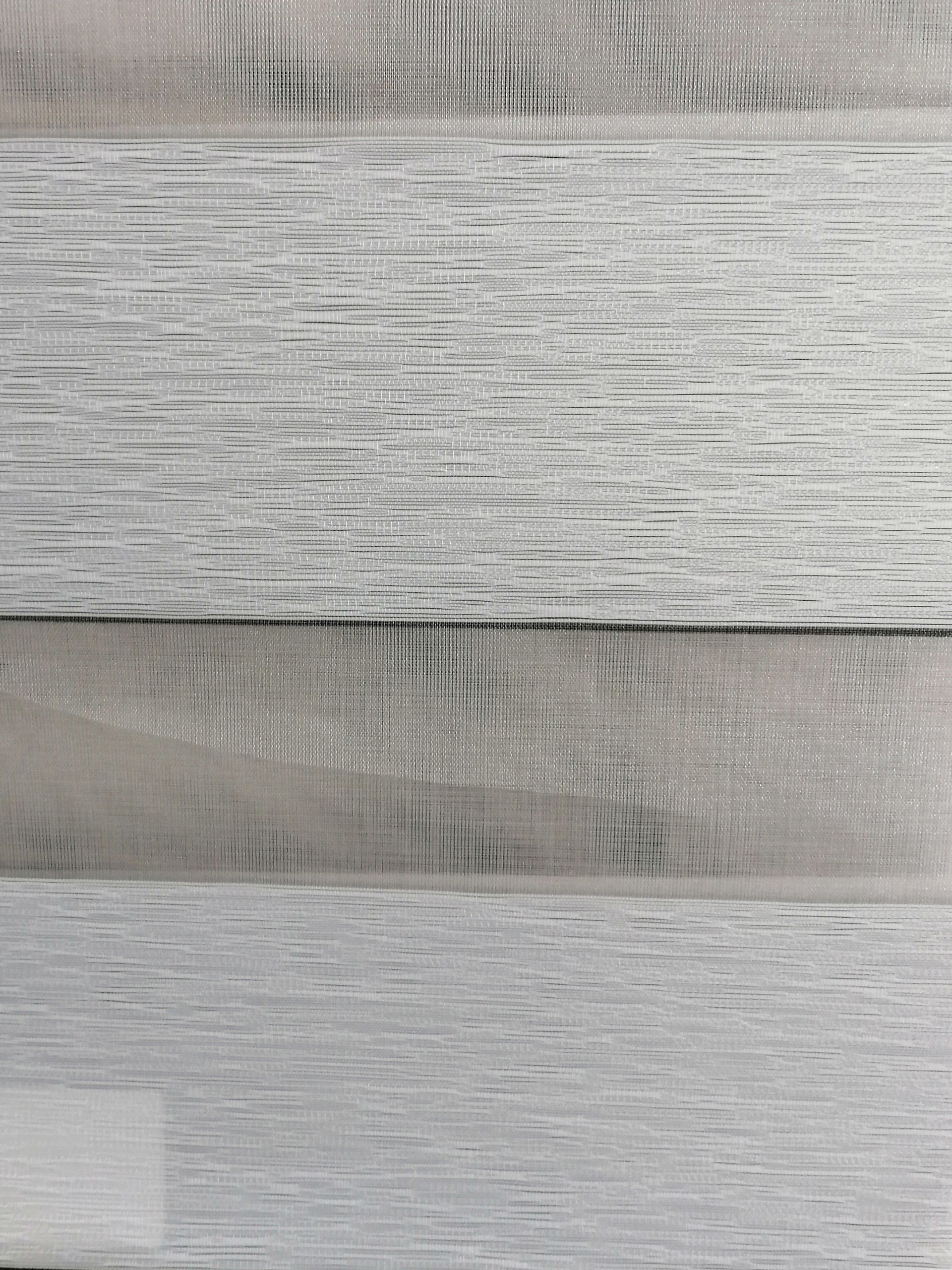 A close up of a piece of wood that looks like a feather.
