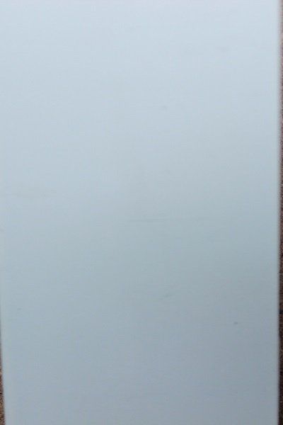 A white sheet of paper is sitting on a table.