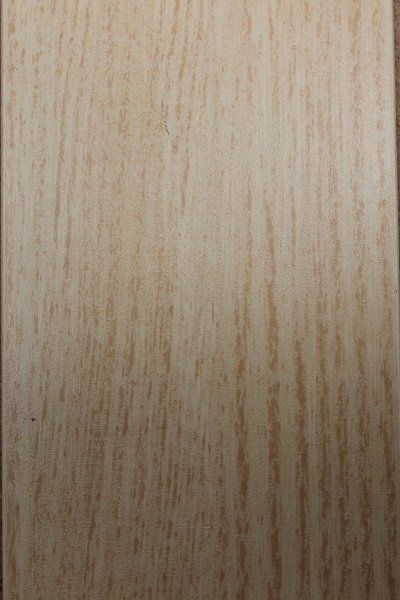 A close up of a piece of wood with a grainy texture.