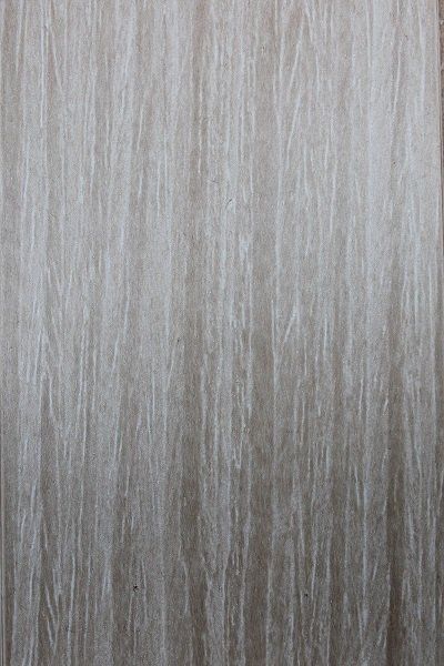 A close up of a piece of paper with a gray texture.