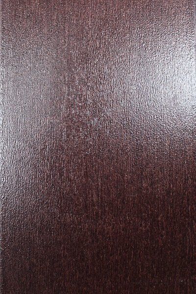 A close up of a piece of brown wood.