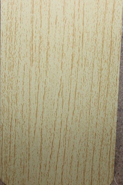 A close up of a piece of wood with a grain pattern.