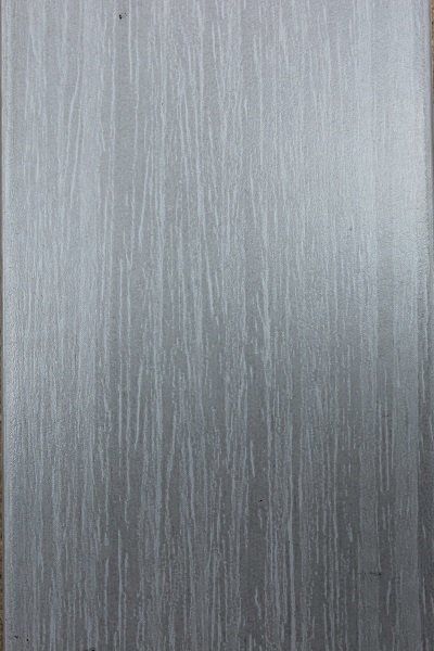 A close up of a piece of wood with a gray grain.