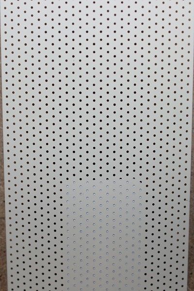 A white board with black dots on it