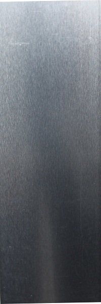 A close up of a stainless steel plate on a white background.